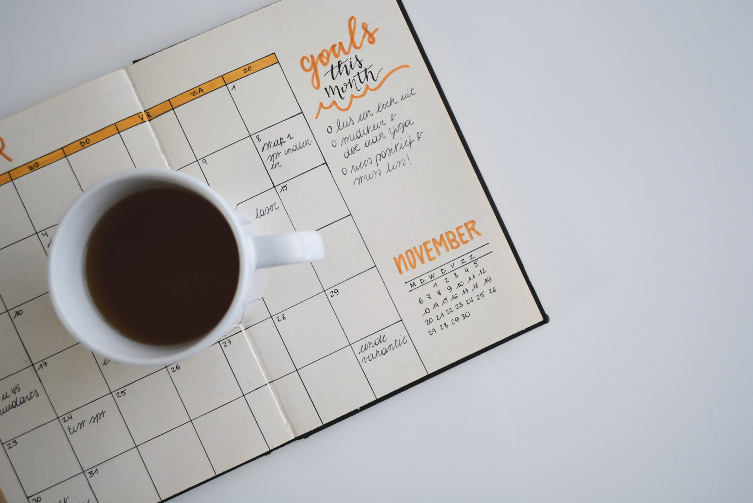 A calendar laid out on a quiet desk